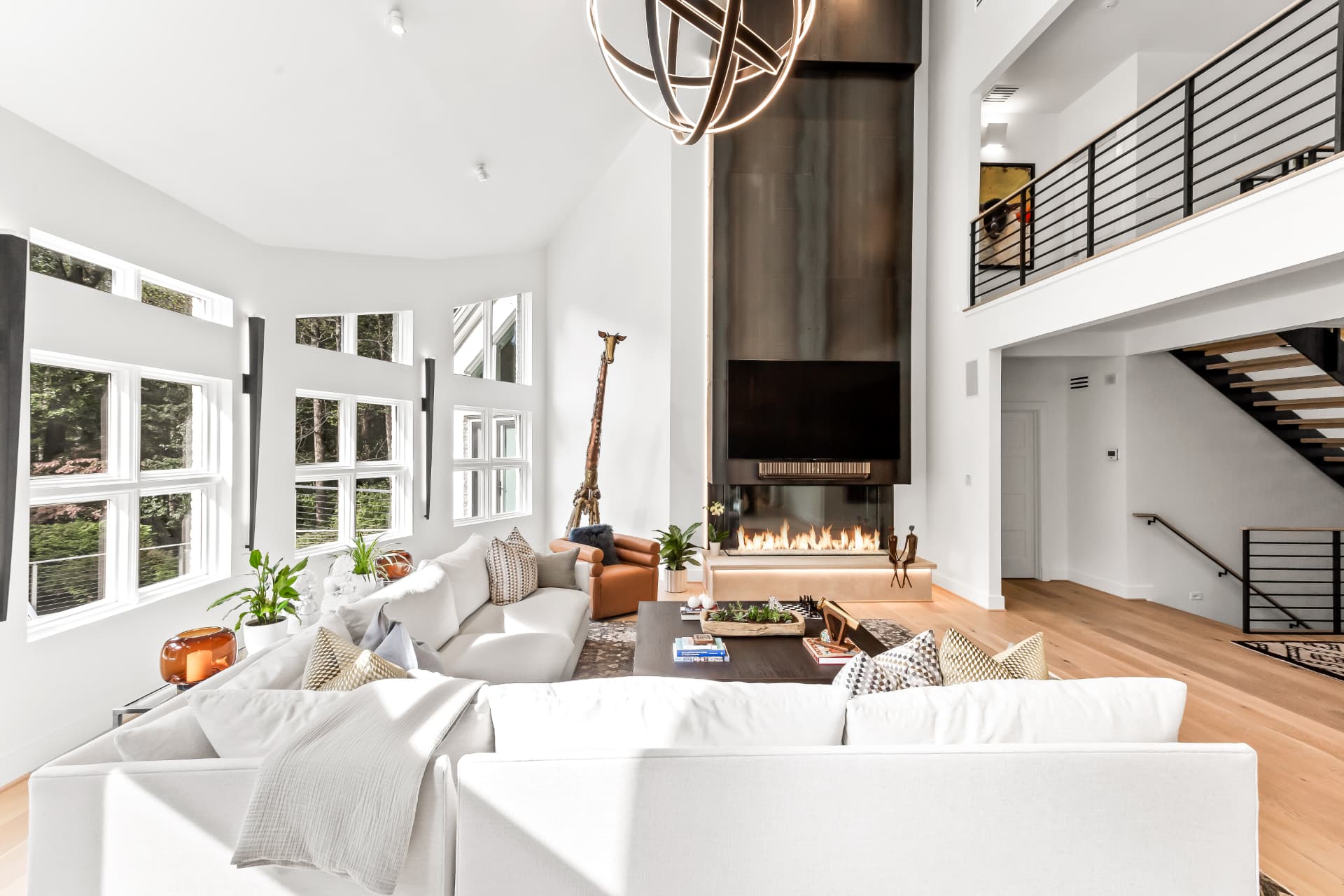 Scherr two-story great room remodel with floor-to-ceiling fireplace and open balcony